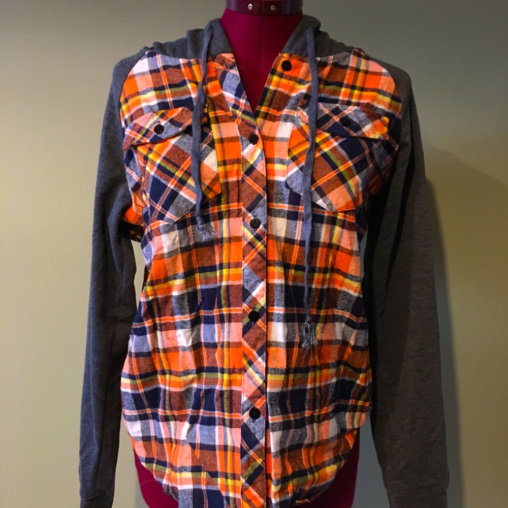 Orange, white and blue plaid with grey sleeves and hood.